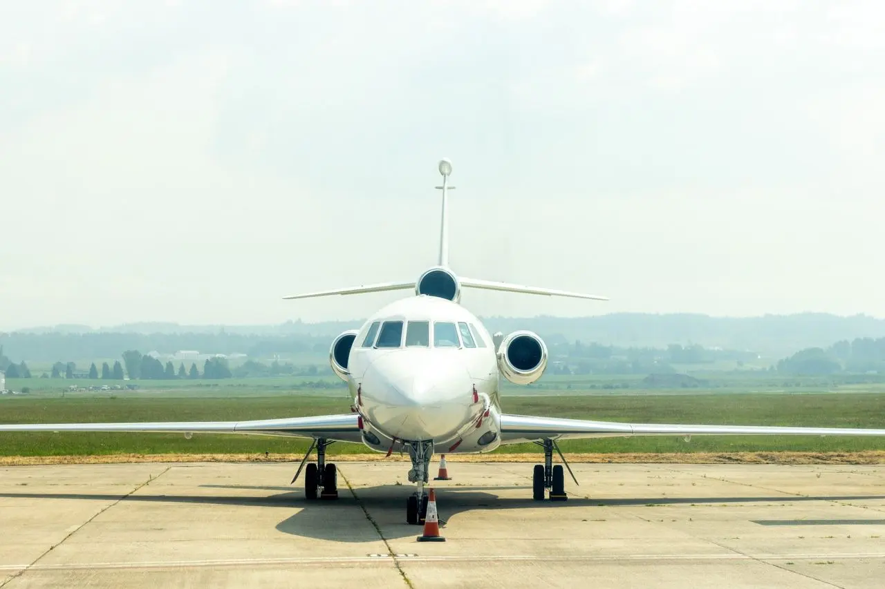 Private jet head-on on a quiet airfield
