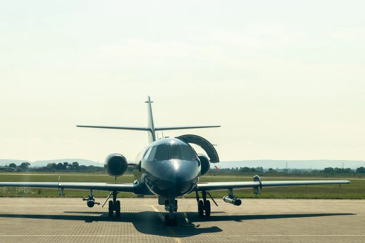 Private jet on the apron head-on, ready for departure