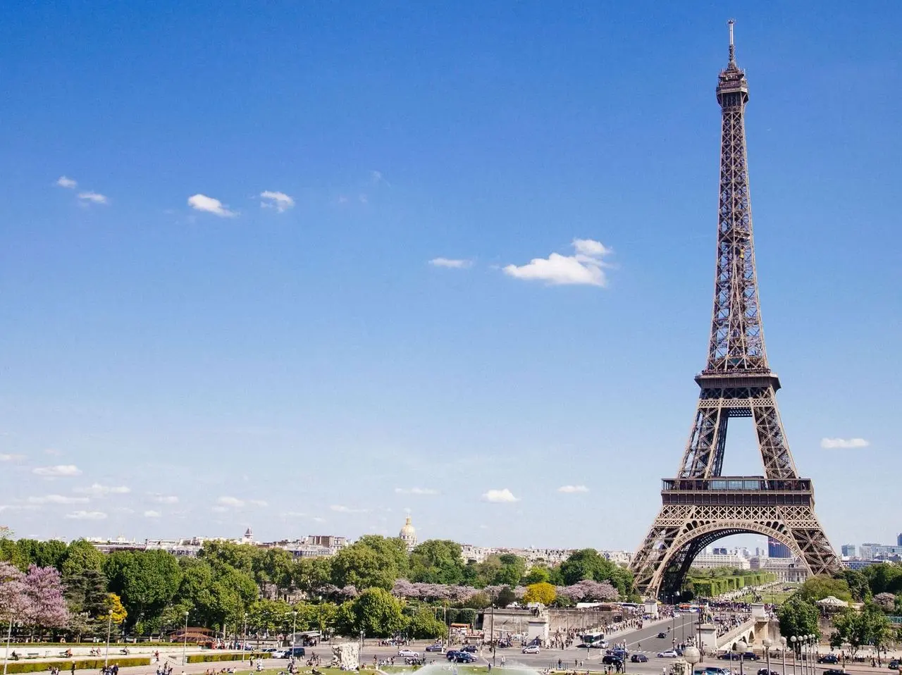 The Eiffel Tower in Paris under a blue sky