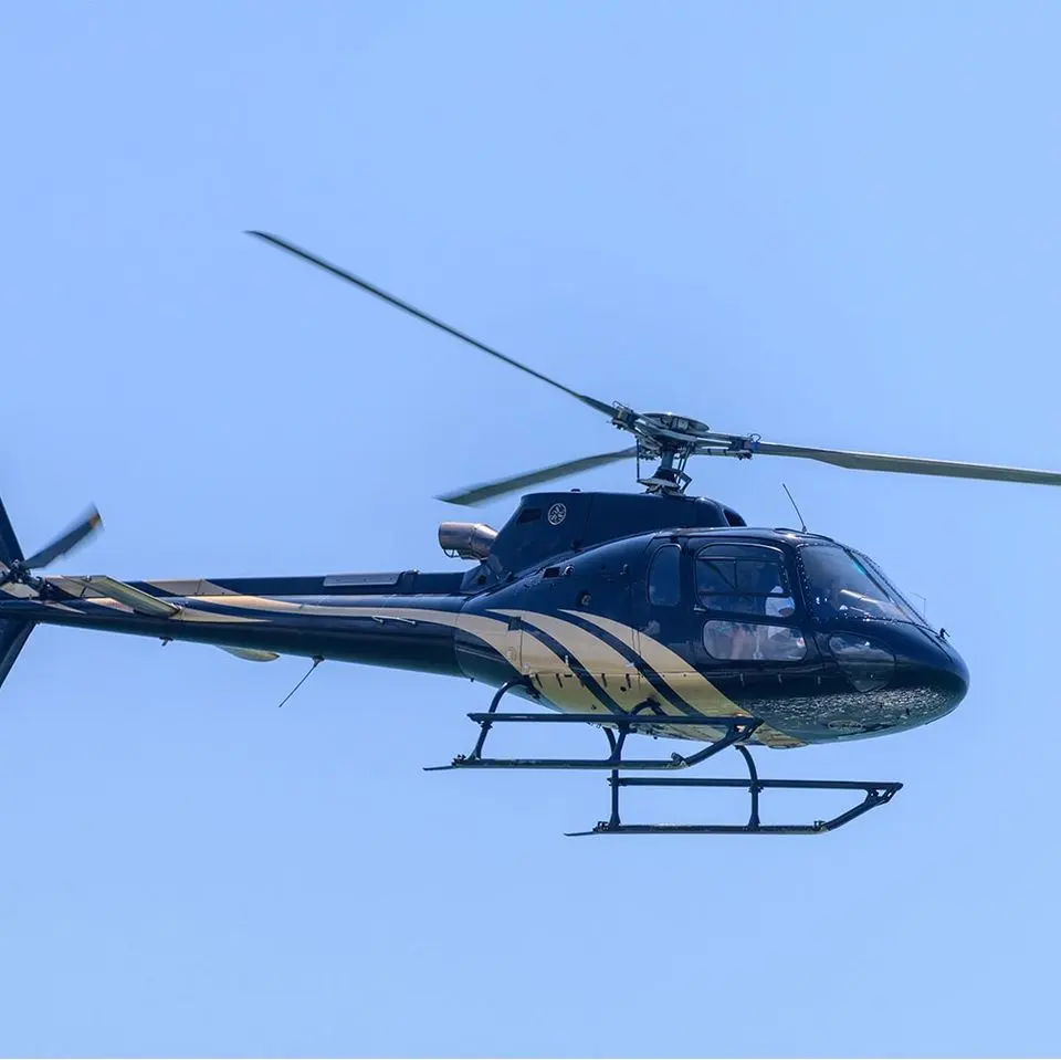 Helicopter flying against a clear blue sky