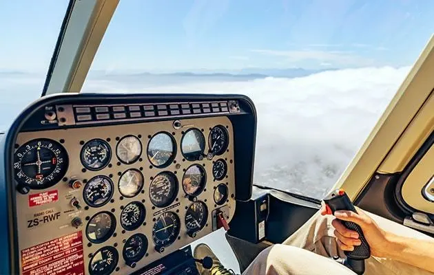 Helicopter cockpit instrument panel with a view of the sky