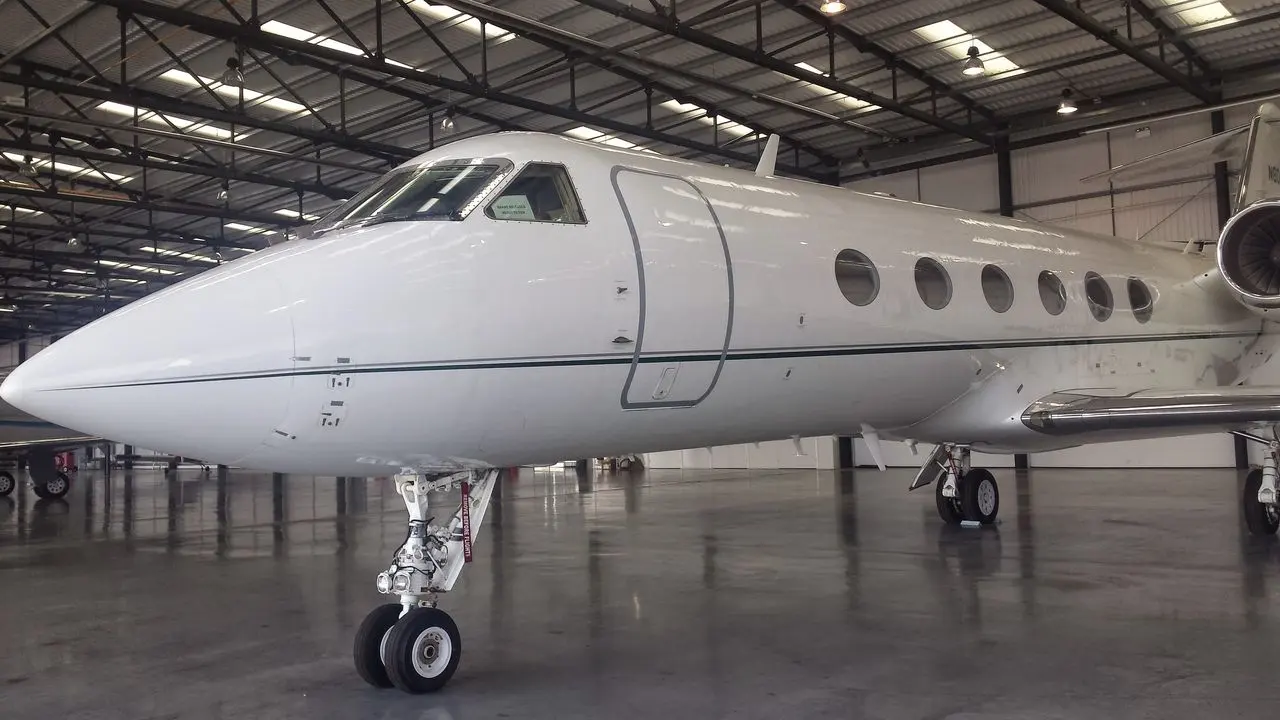 Large private jet in a hangar