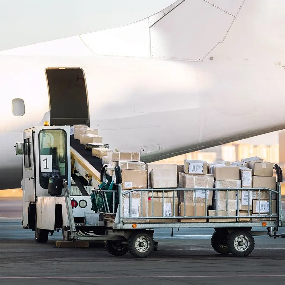 Cargo being loaded onto an aircraft from a ground loader