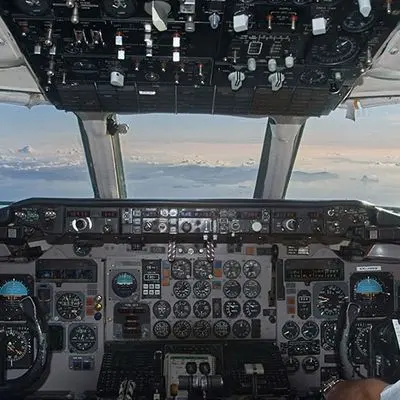 Aircraft flight deck with instrument panels, dials and controls