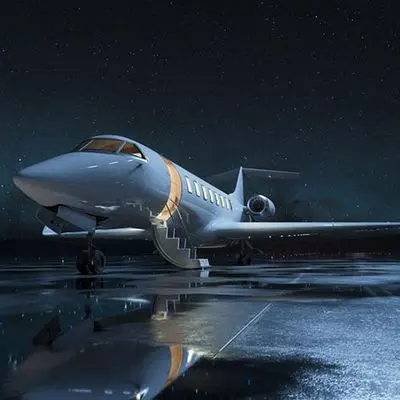 Private jet on a wet tarmac at night with reflections on the ground